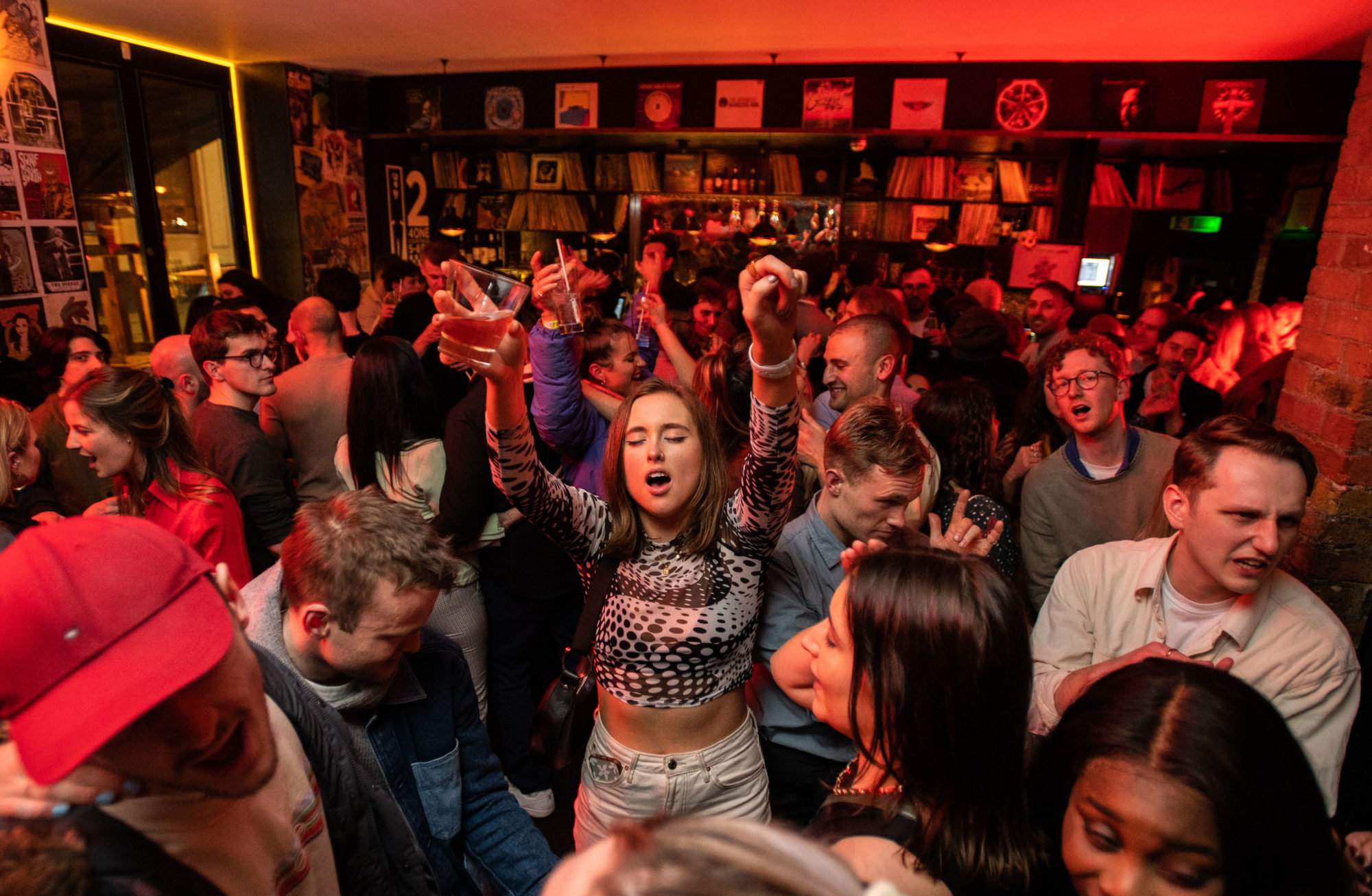 Crowd dancing to a DJ at Venn Street Records, Clapham.