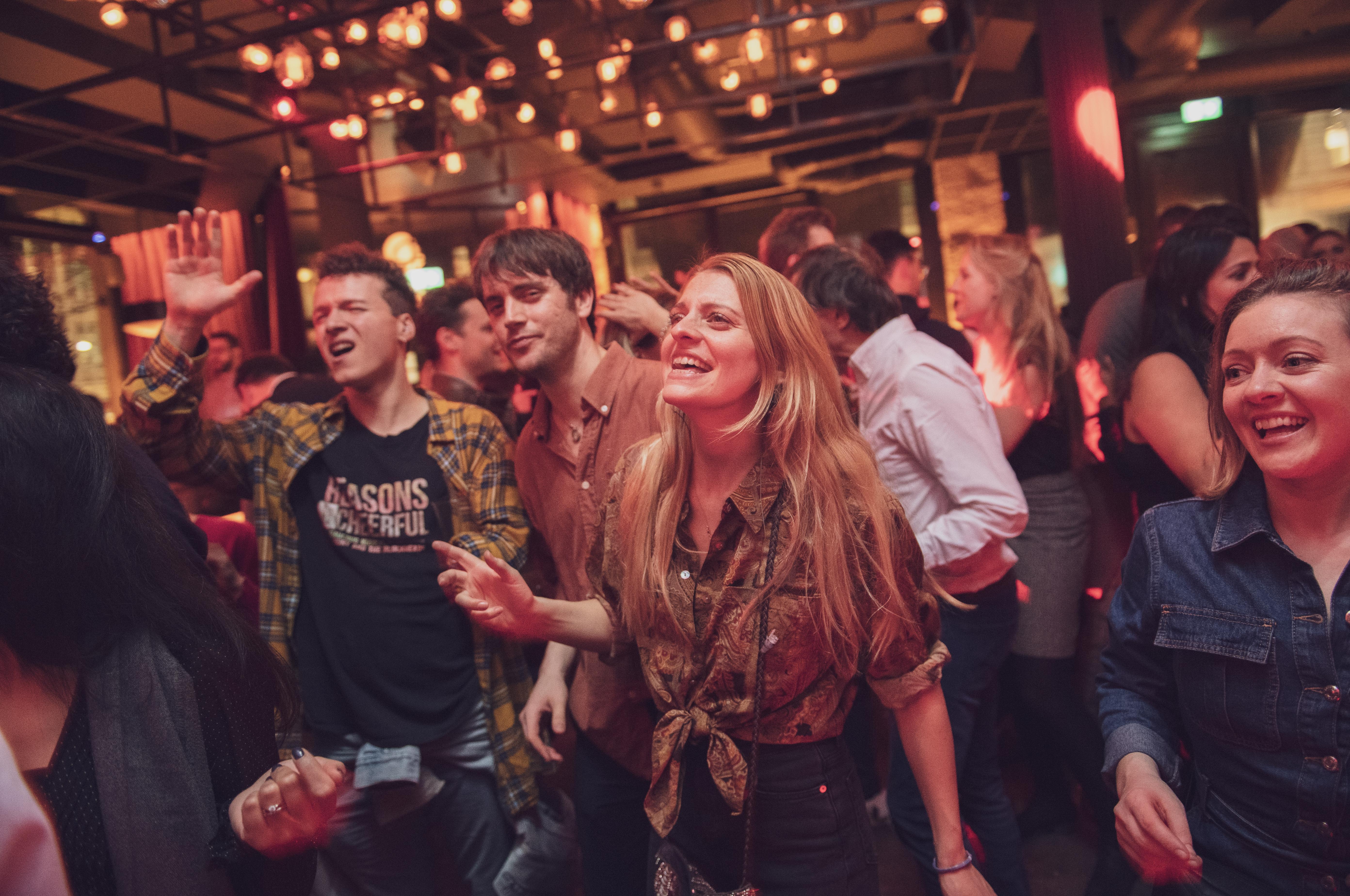 Crowd dancing to a DJ at Eastcheap Records, Monument.