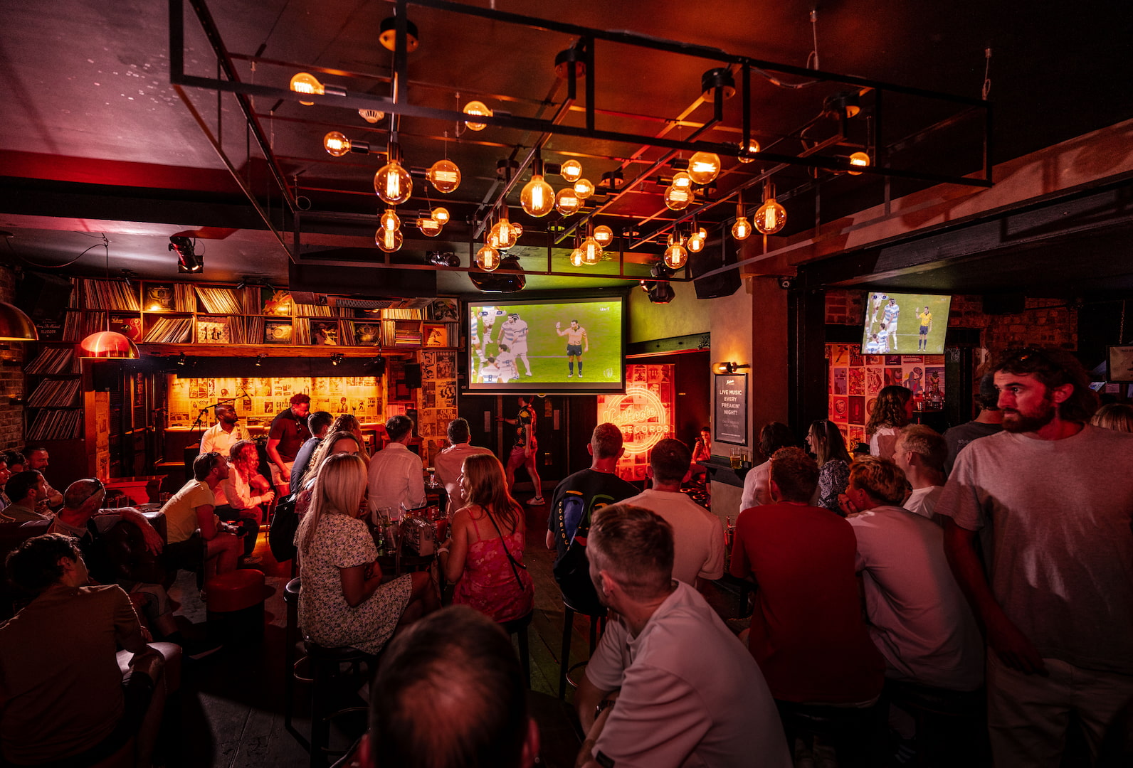 People enjoying watching England at the Rugby Six Nations at Northcote Records